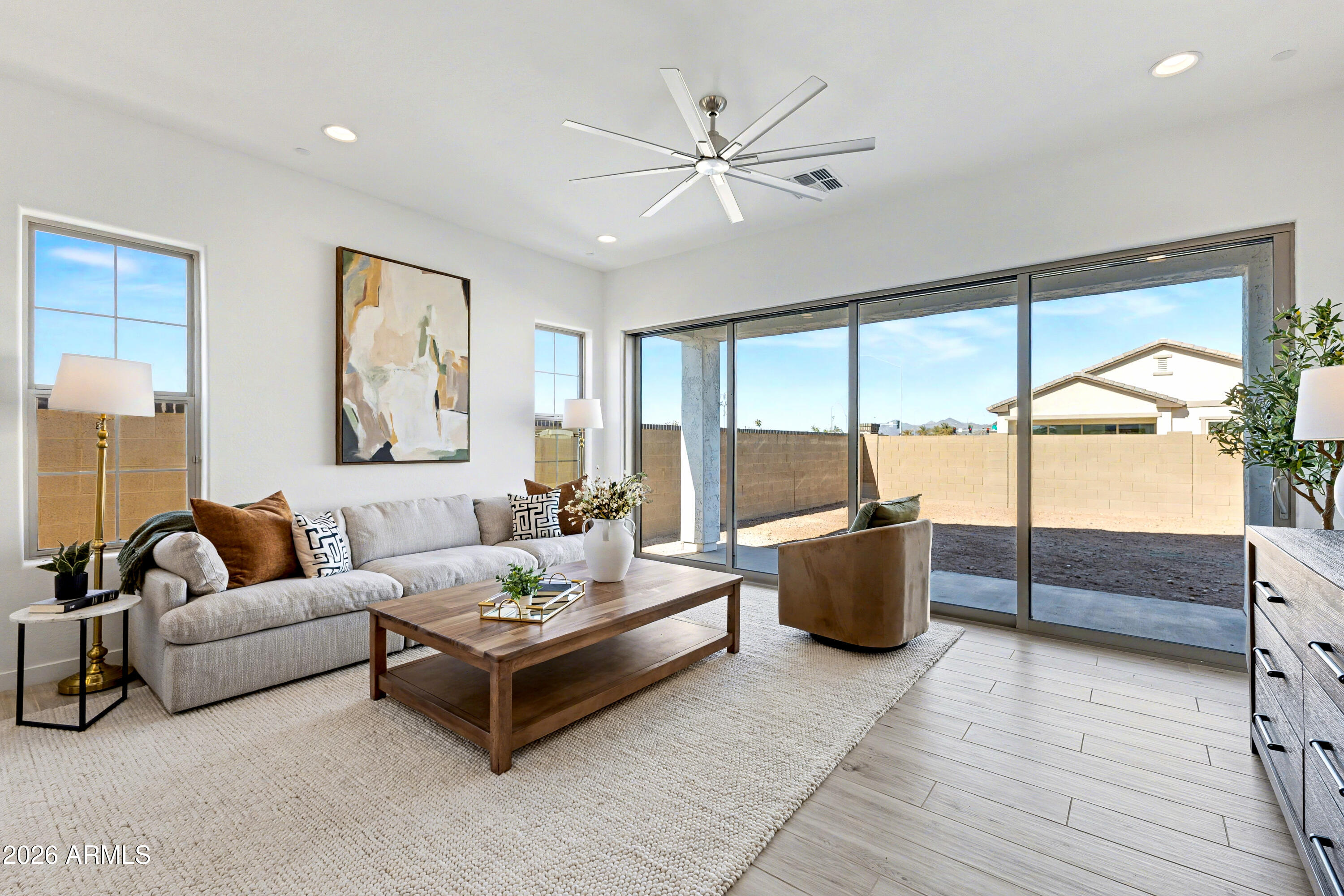 3618 East Roland Street Mesa, AZ 85213 - Photo 3 of 26 a living room with furniture and a large window