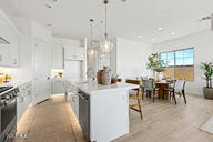 3618 East Roland Street Mesa, AZ 85213 - Photo 5 of 26 a view of a dining area with furniture