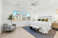 3618 East Roland Street Mesa, AZ 85213 - Photo 8 of 26 a bedroom with a bed and a couch