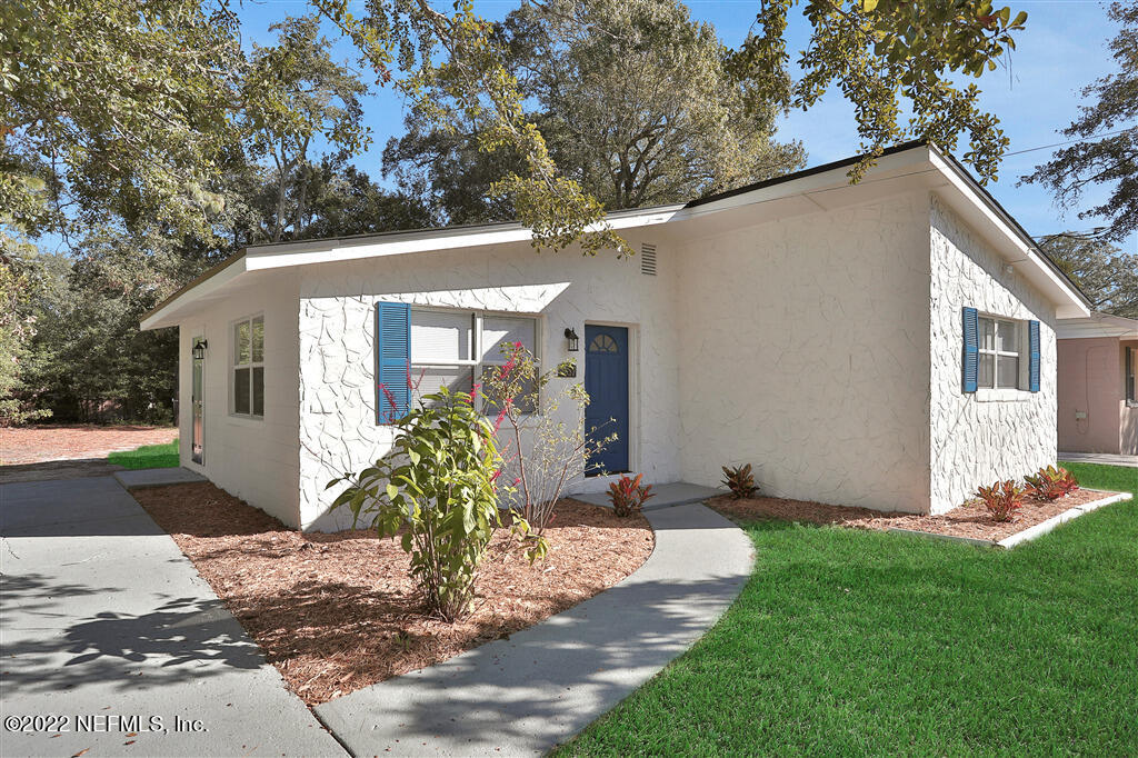 4657 Colchester Road Jacksonville, FL 32208 - Photo 22 of 23 a front view of a house with garden