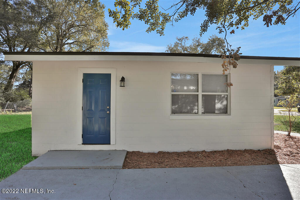 4657 Colchester Road Jacksonville, FL 32208 - Photo 23 of 23 a front view of a house with a yard