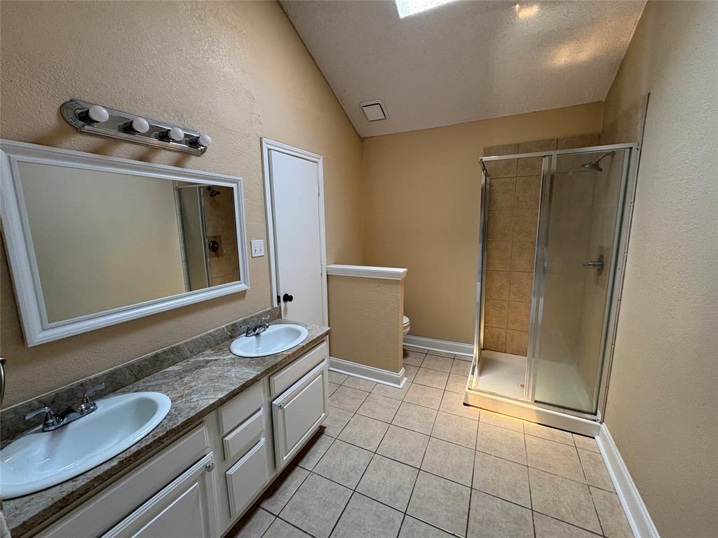 2002 Azalea Street Denton, TX 76205 - Photo 14 of 15 Double sinks in the primary bathroom