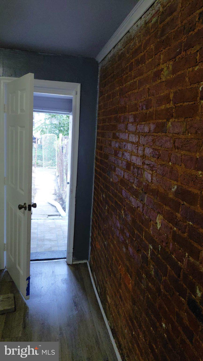 2121 Wilhelm Street Baltimore, MD 21223 - Photo 13 of 13 Charming entryway with exposed brick.