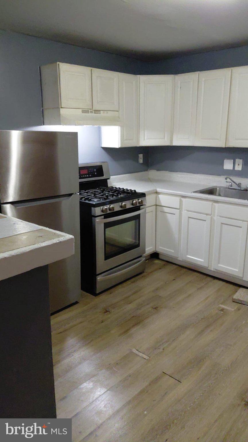 2121 Wilhelm Street Baltimore, MD 21223 - Photo 2 of 13 Modern kitchen with sleek finishes.