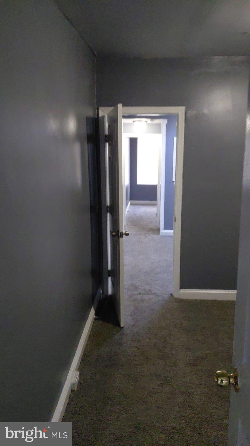 2121 Wilhelm Street Baltimore, MD 21223 - Photo 6 of 13 Inviting hallway with open doors.