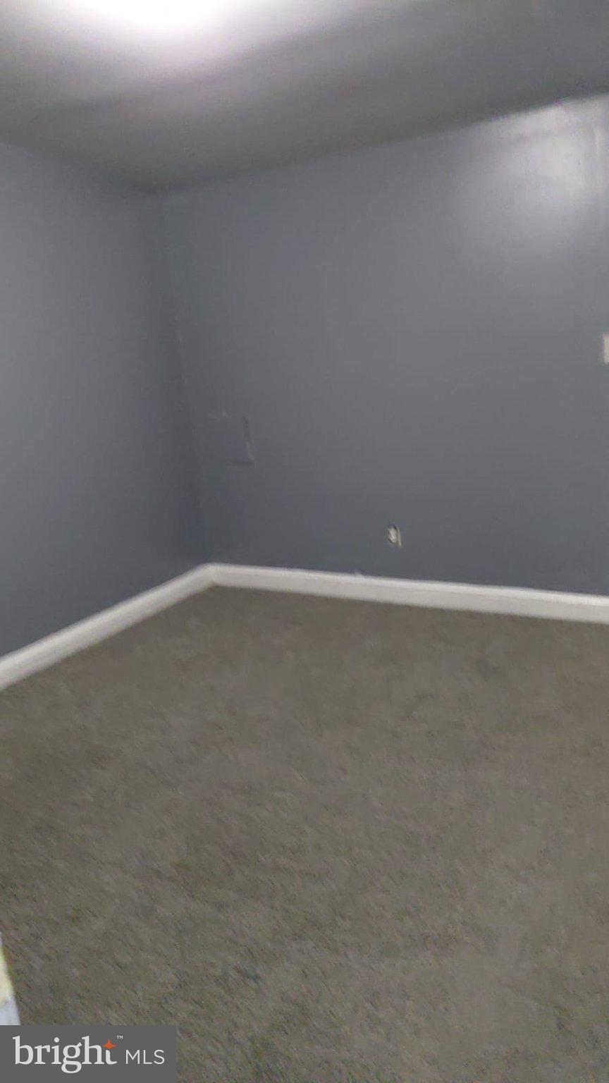 2121 Wilhelm Street Baltimore, MD 21223 - Photo 7 of 13 Spacious room with calming gray walls.