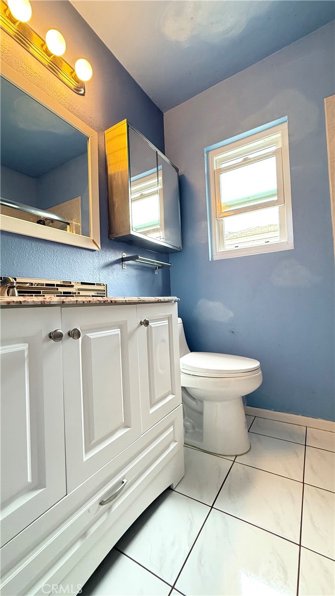 230 San Antonio Road Arcadia, CA 91007 - Photo 18 of 19 a bathroom with a toilet sink and mirror
