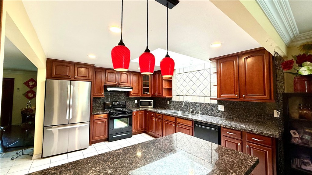 230 San Antonio Road Arcadia, CA 91007 - Photo 6 of 19 a kitchen with stainless steel appliances granite countertop a sink a stove and a refrigerator