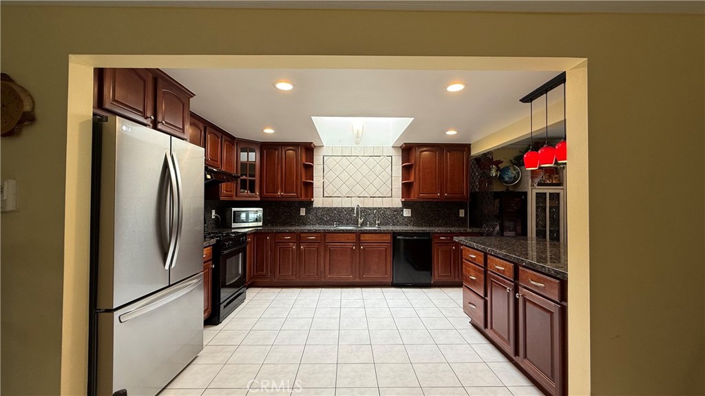230 San Antonio Road Arcadia, CA 91007 - Photo 8 of 19 a large kitchen with stainless steel appliances granite countertop a refrigerator and a sink