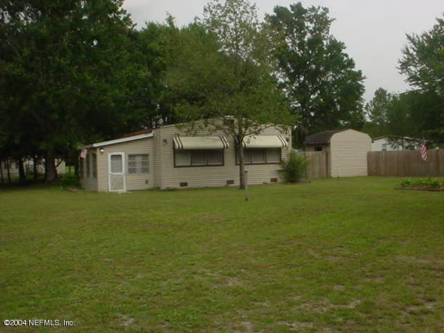 4126 Pinto Road Middleburg, FL 32068 - Photo 1 of 1 a view of a house with a yard