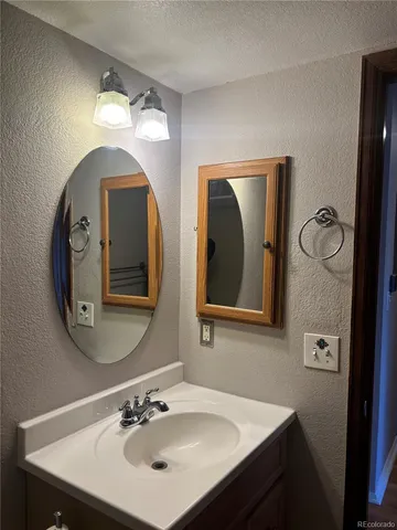 a bathroom with 2 sink and a mirror