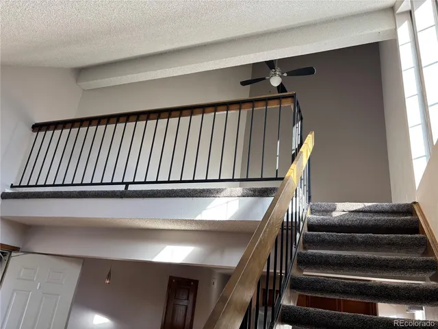 a view of staircase with wooden floor