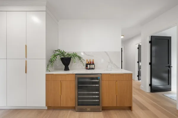 a living room with furniture and large windows