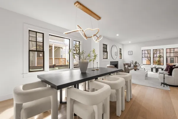 a bedroom with bed and a large window