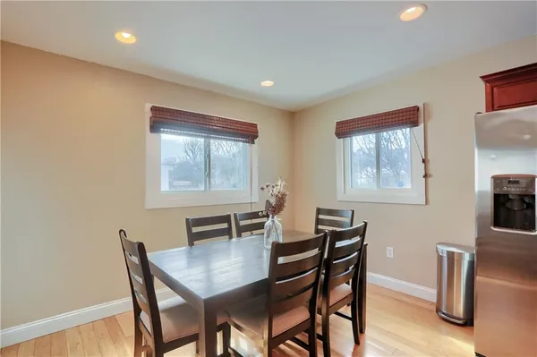 a dining room with furniture and window