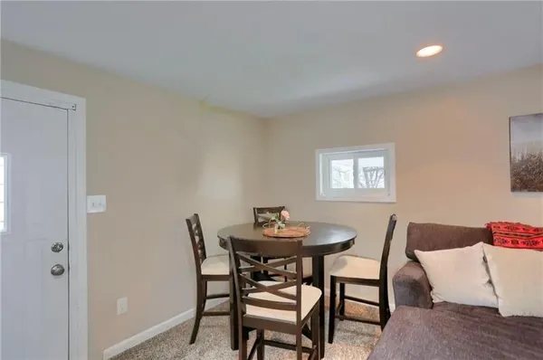 a view of a hallway with seating area