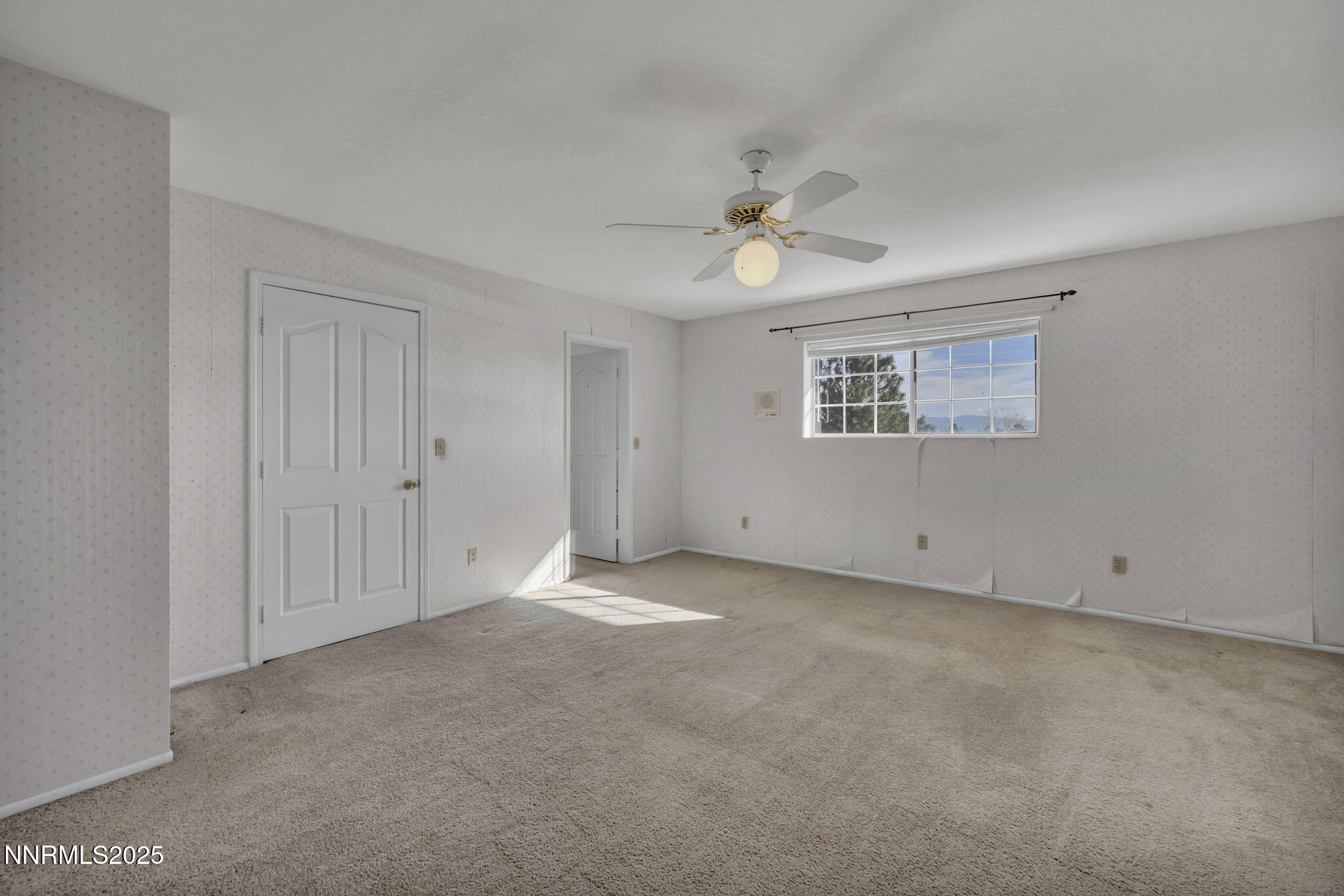 2395 Jacks Valley Road Genoa, NV 89411 - Photo 16 of 33 a view of an empty room with a window