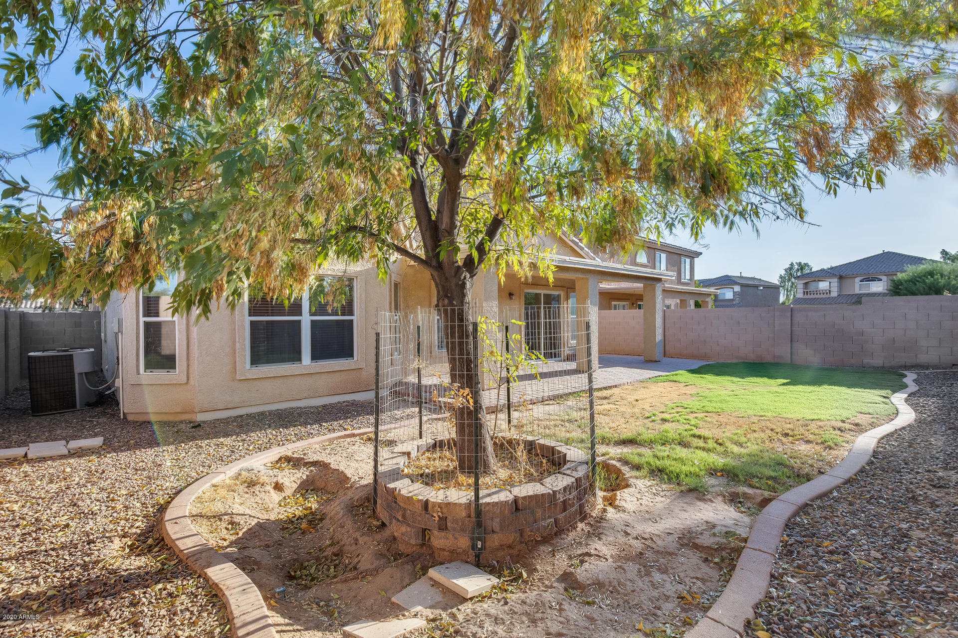 15644 West Calavar Road Surprise, AZ 85379 - Photo 33 of 34 a backyard of a house with barbeque oven