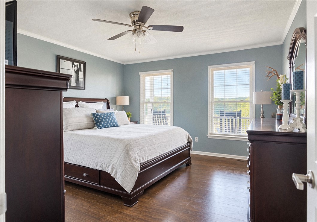 2420 Rainey Road Starr, SC 29684 - Photo 14 of 36 Hardwood floors and dual windows frame the peaceful views in this restful bedroom retreat.