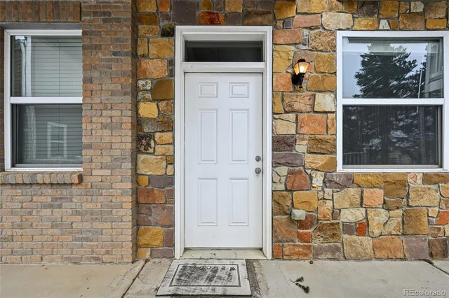 a view of a brick buildings with many windows