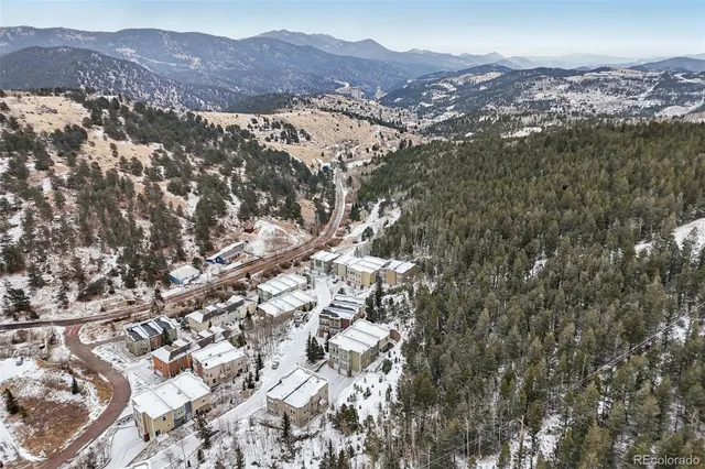 a view of a city with mountains in the background