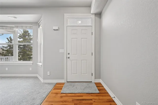 an empty room with furniture and a fireplace