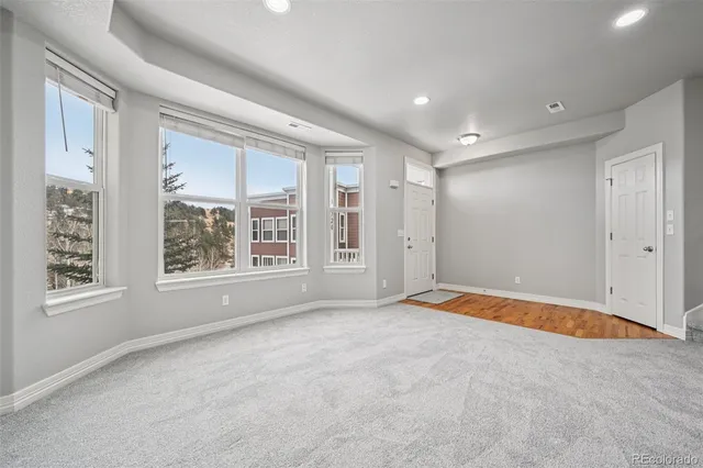 a view of a livingroom with a fireplace a chandelier