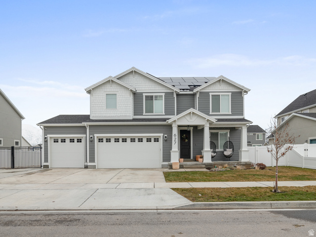627 South Meade Street Mapleton, UT 84664 - Photo 1 of 48 Contemporary two-story residence featuring grey siding, white trim, and a covered front porch with white columns
