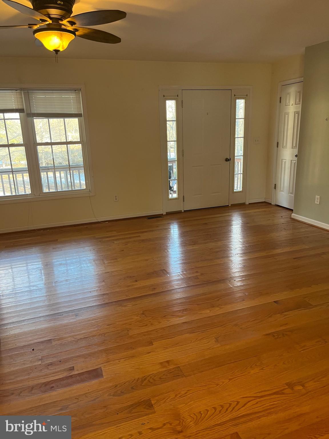 20404 Gum Tree Road Orange, VA 22960 - Photo 2 of 12 an empty room with wooden floor and windows