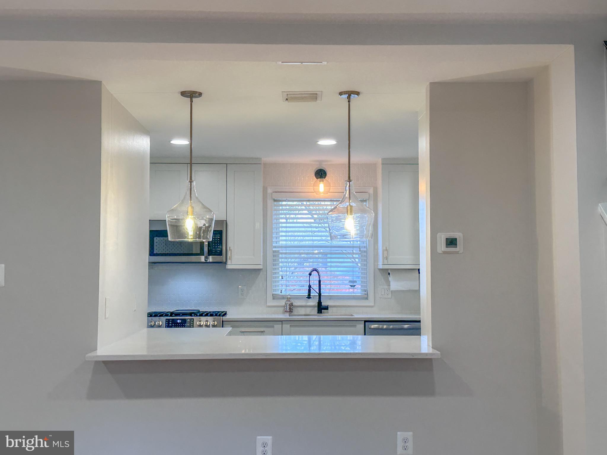 226 Guthrie Avenue Alexandria, VA 22305 - Photo 12 of 54 a view of a kitchen with a sink and a window
