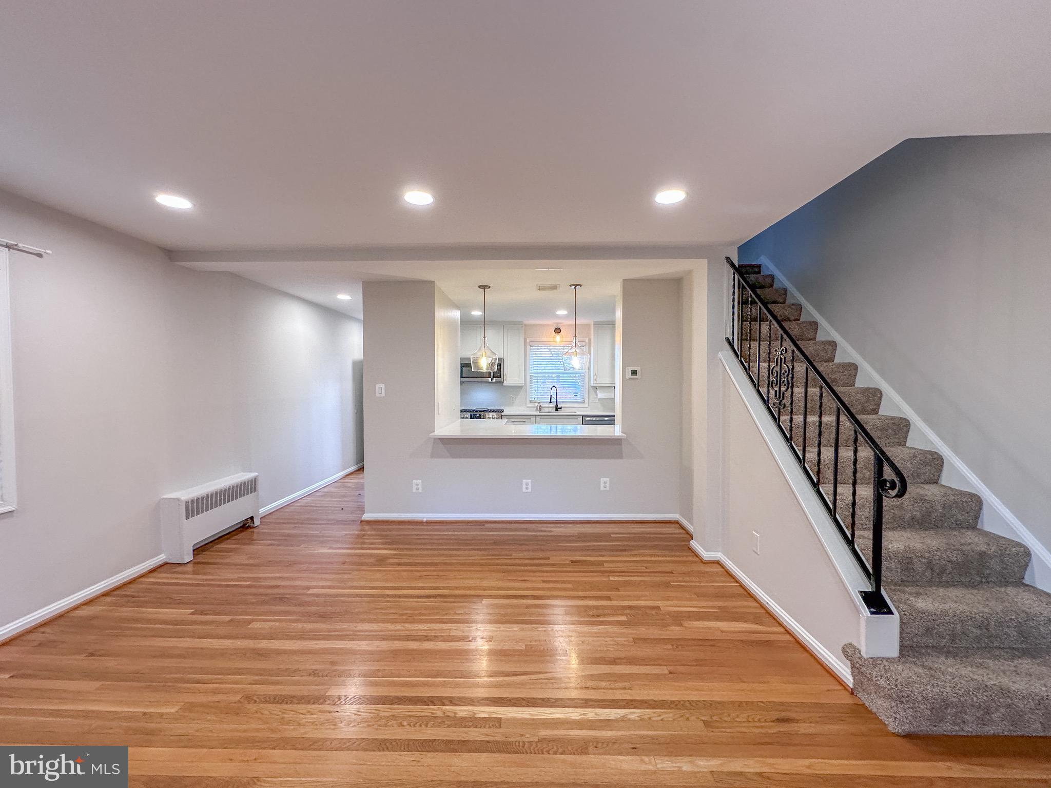 226 Guthrie Avenue Alexandria, VA 22305 - Photo 18 of 54 a view of an empty room with wooden floor and stairs