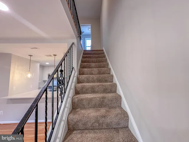 a bathroom with a sink mirror and toilet