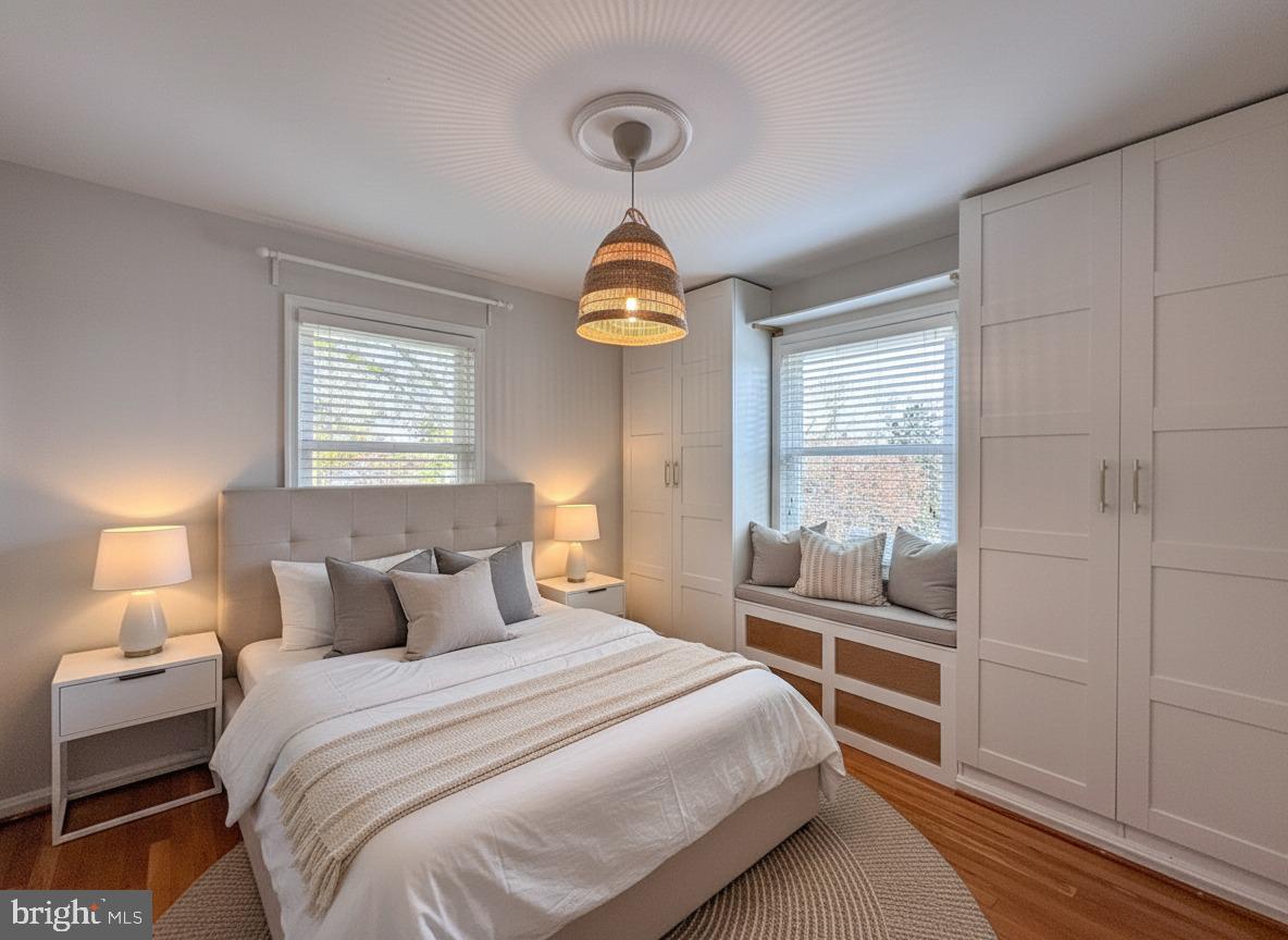 226 Guthrie Avenue Alexandria, VA 22305 - Photo 22 of 54 a bedroom with a bed and a chandelier