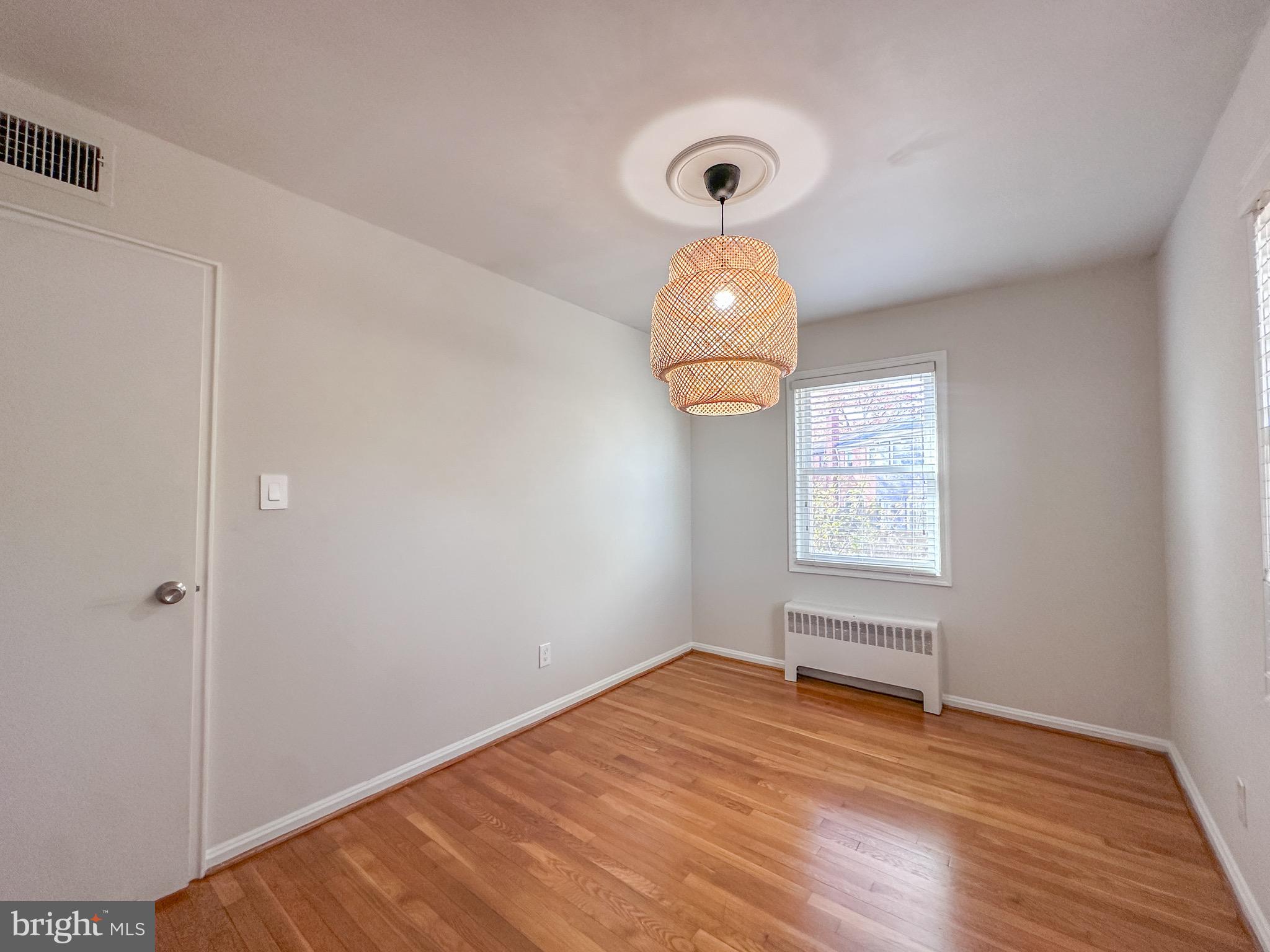 226 Guthrie Avenue Alexandria, VA 22305 - Photo 25 of 54 a view of empty room with wooden floor