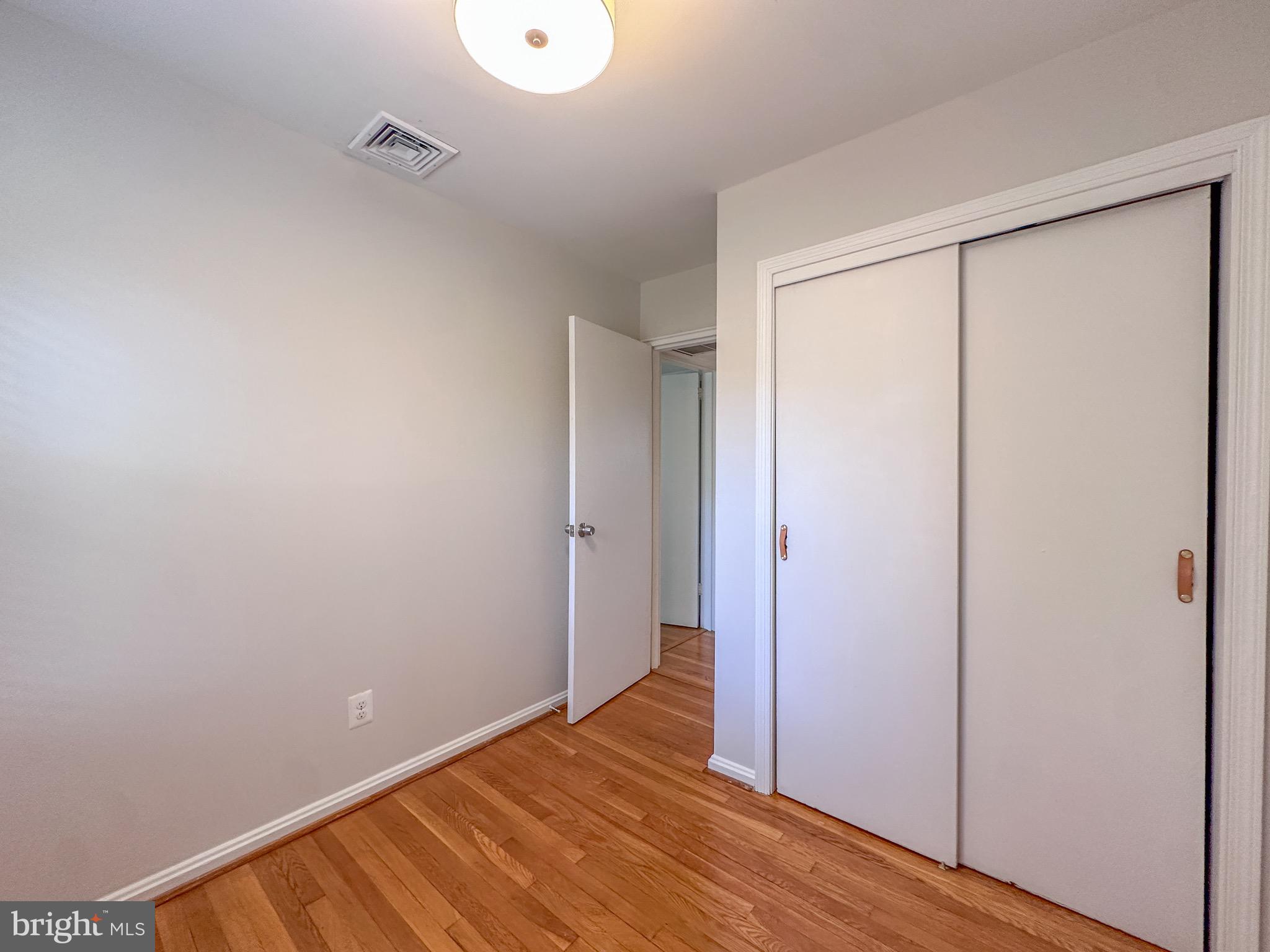 226 Guthrie Avenue Alexandria, VA 22305 - Photo 29 of 54 a view of an empty room with wooden floor