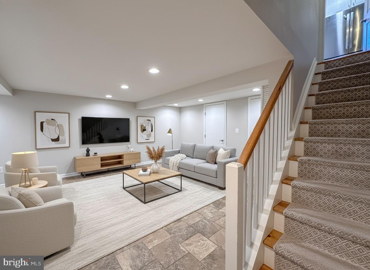 226 Guthrie Avenue Alexandria, VA 22305 - Photo 31 of 54 a living room with furniture and a flat screen tv