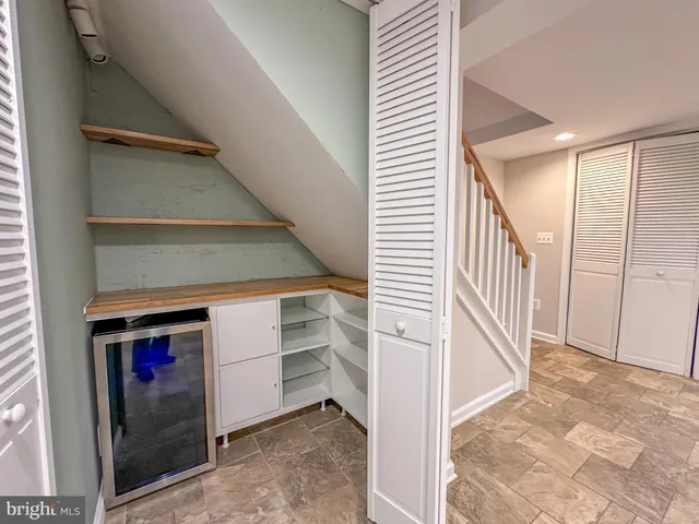 a bathroom with a double vanity sink toilet and shower