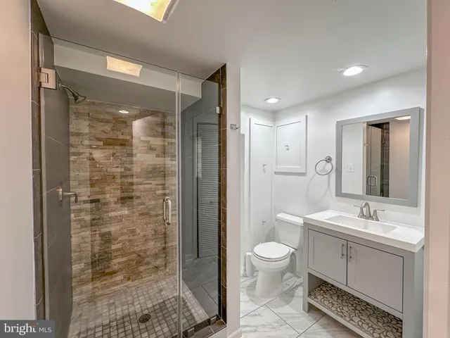 a backyard of a house with barbeque oven table and chairs