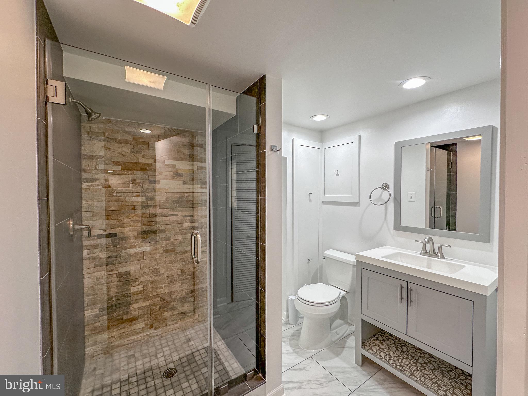 226 Guthrie Avenue Alexandria, VA 22305 - Photo 35 of 54 a bathroom with a double vanity sink toilet and shower