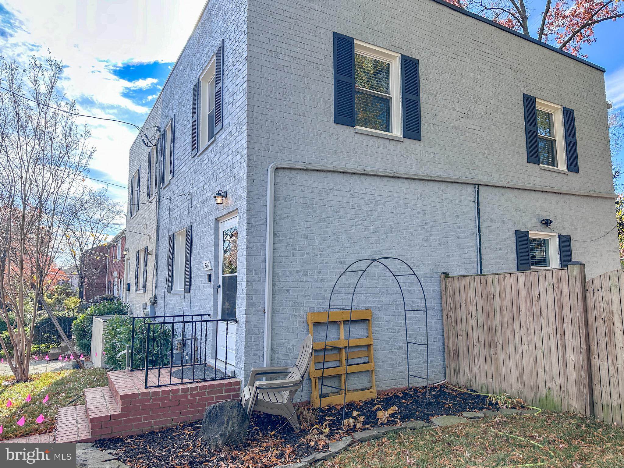 226 Guthrie Avenue Alexandria, VA 22305 - Photo 37 of 54 a backyard of a house with barbeque oven table and chairs
