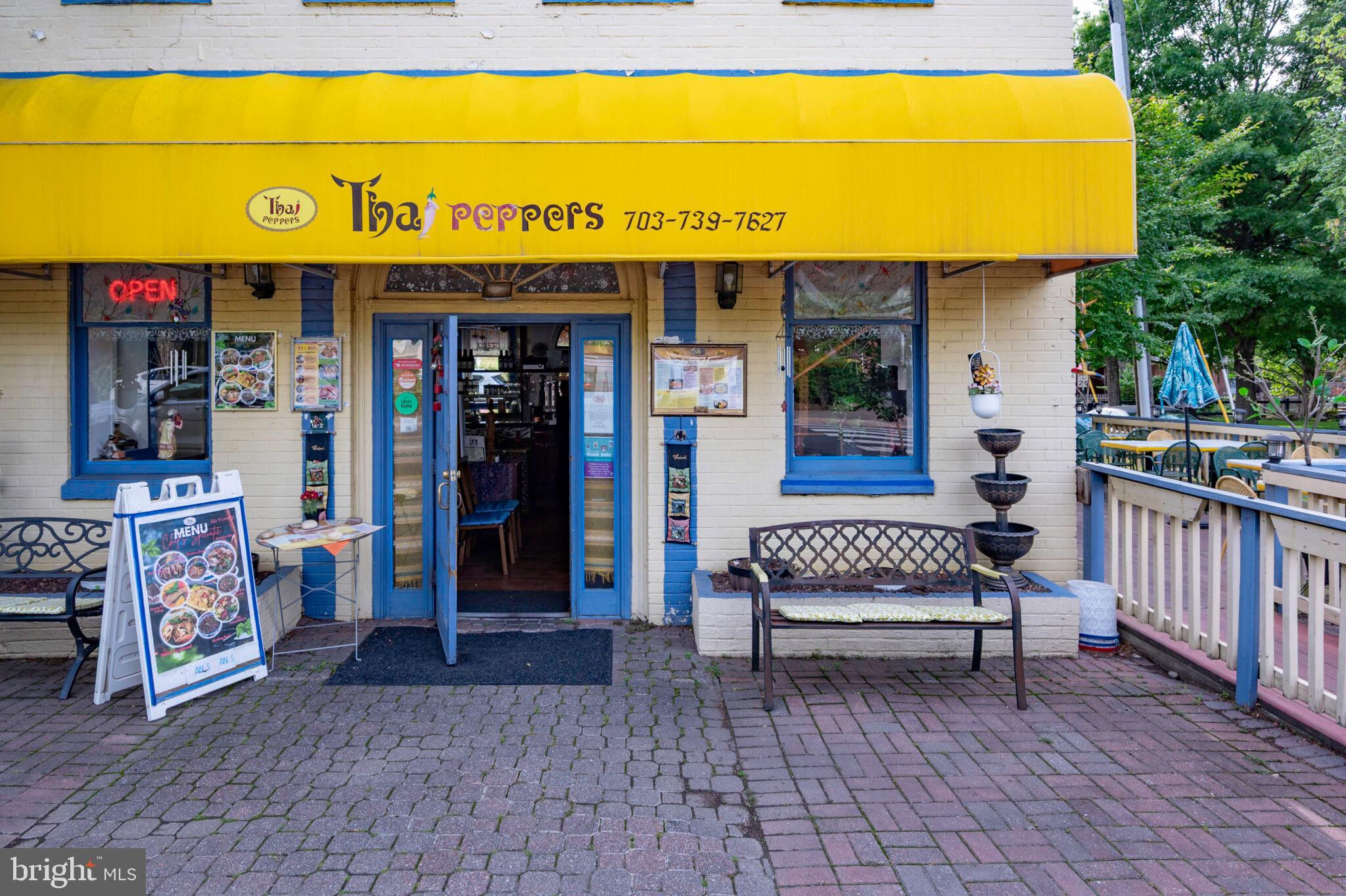226 Guthrie Avenue Alexandria, VA 22305 - Photo 45 of 54 a view of a shop with a brick wall and a barbeque