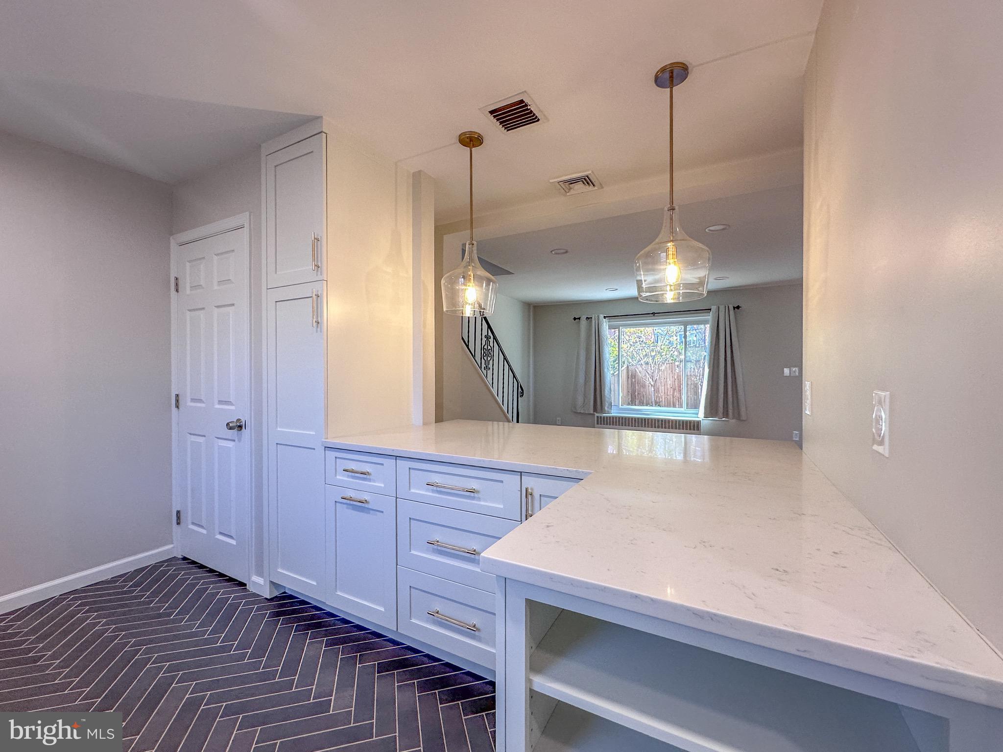 226 Guthrie Avenue Alexandria, VA 22305 - Photo 6 of 54 a view of a kitchen from a hallway