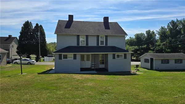 a house view with a play ground