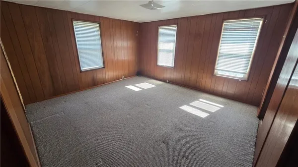 a view of empty room with windows