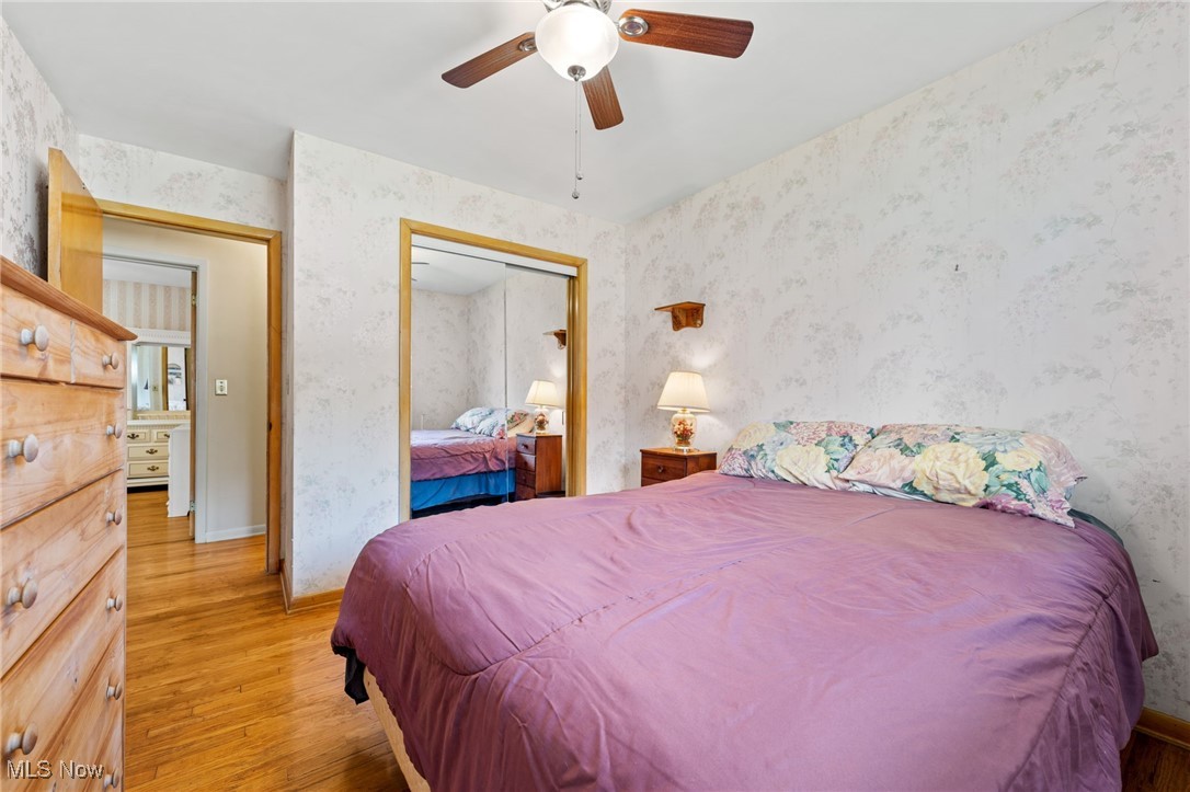 7702 Ragall Parkway Cleveland, OH 44130 - Photo 20 of 41 Bedroom featuring ceiling fan, light hardwood / wood-style flooring, and a closet