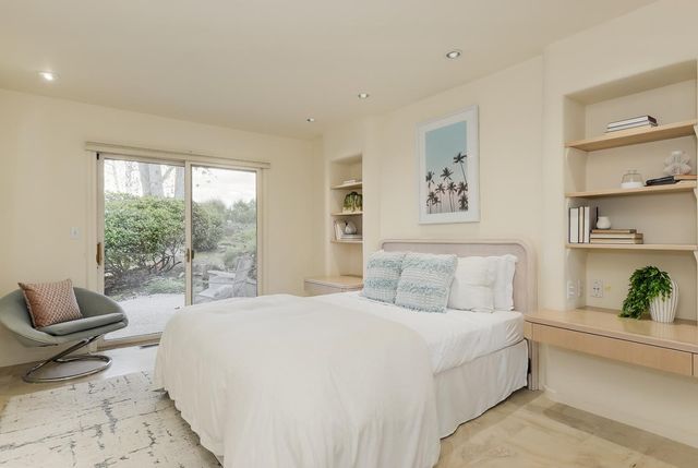 a front view of a house with swimming pool having outdoor seating