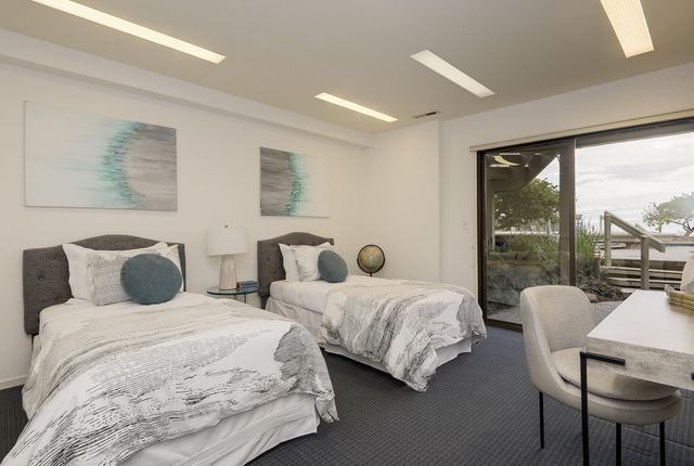 a view of a city and mountains in front of a house