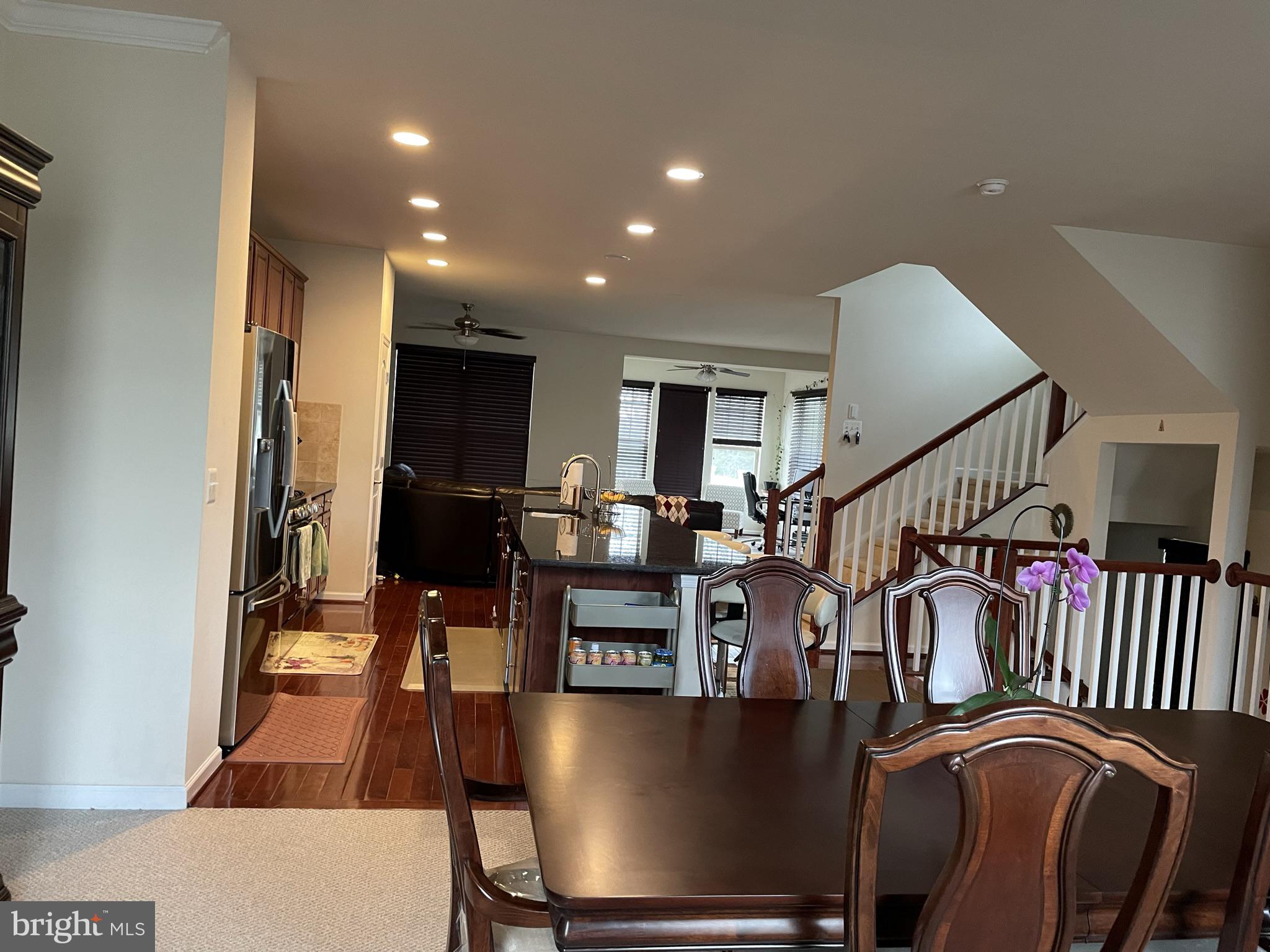 a view of a living room and workspace with furniture