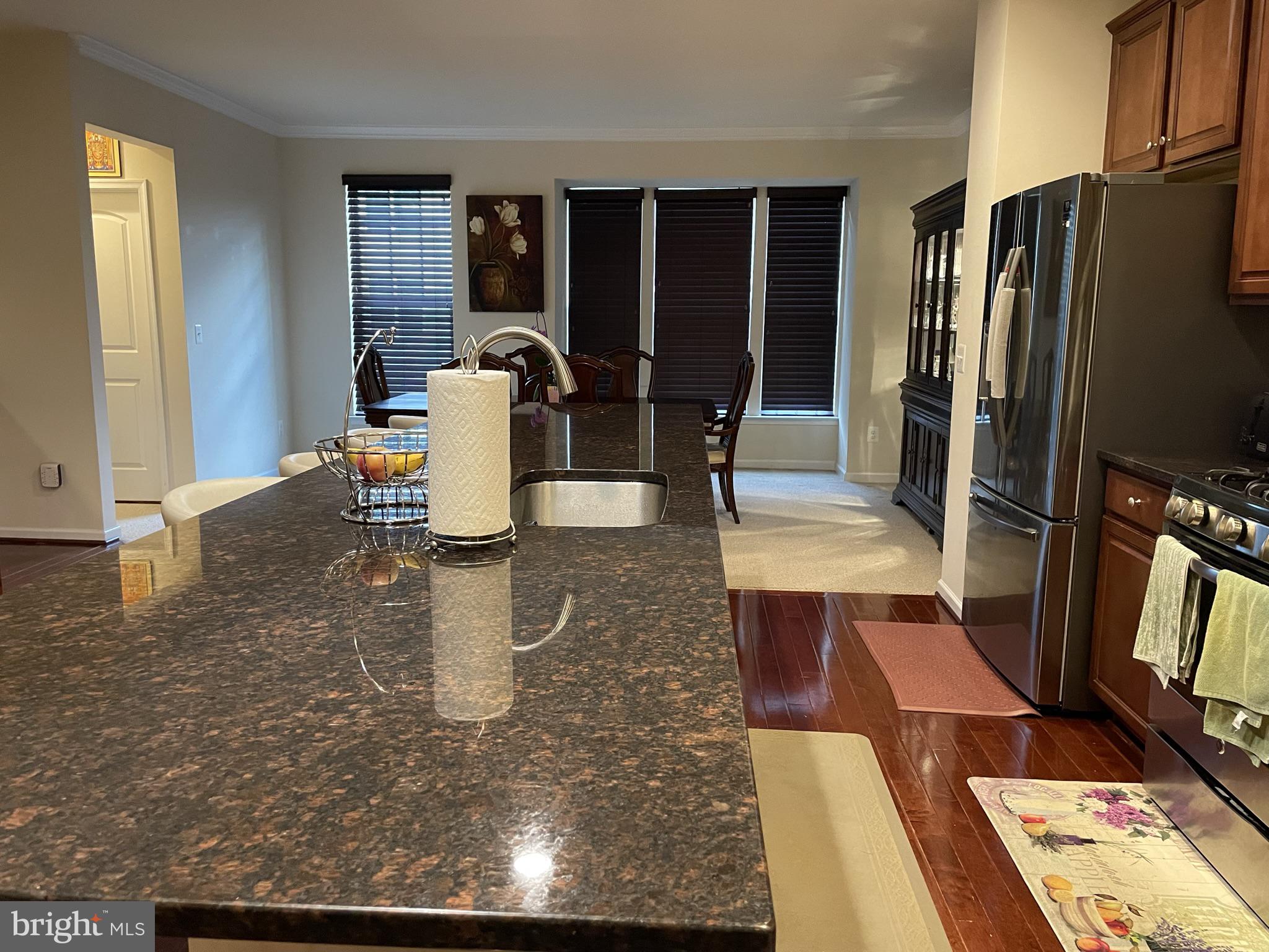 25271 Sackwheat Square Chantilly, VA 20152 - Photo 22 of 24 a dining room with furniture and a rug