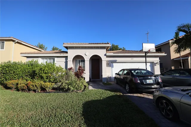 a view of a car parked in front of a house